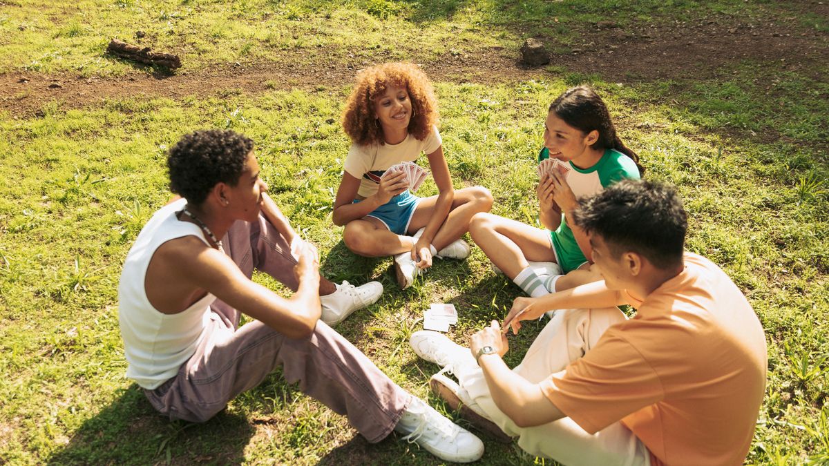 Teens sitting in a circle, talking and listening