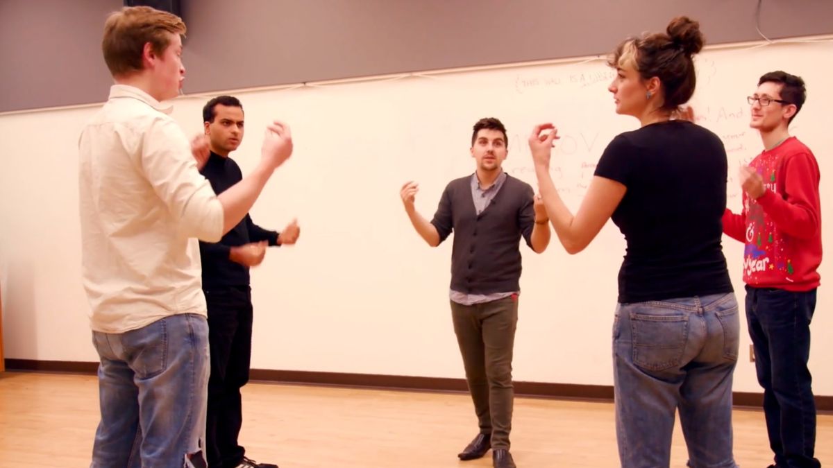 Tony leading students in an improv warm-up